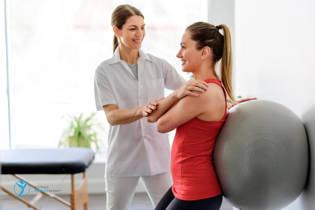 physiotherapist guiding exercise