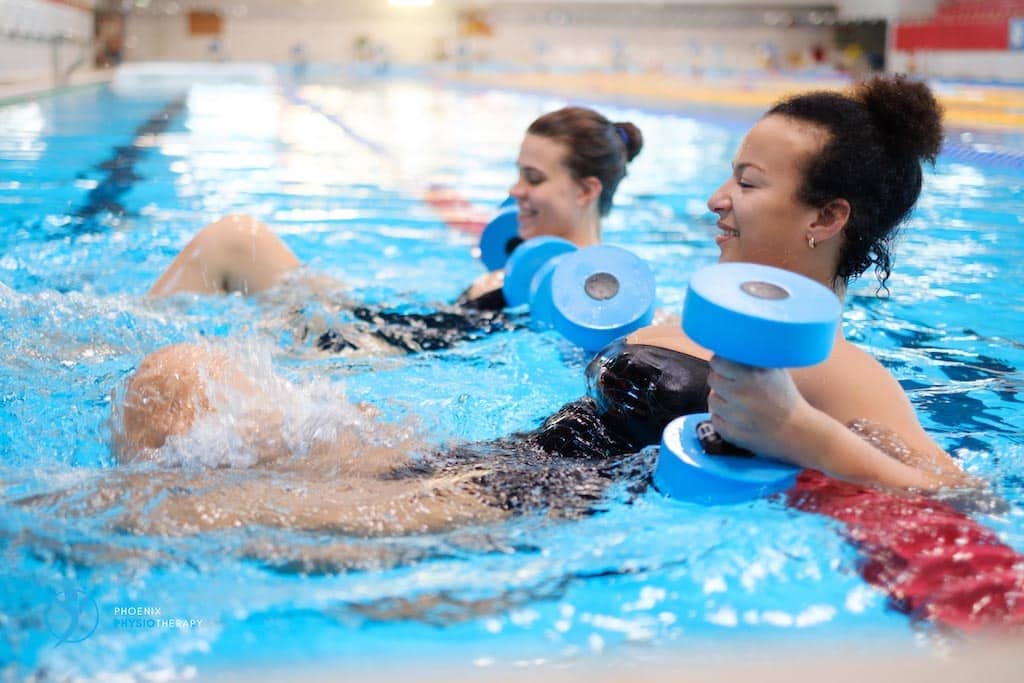 therapist and patient rehab in water