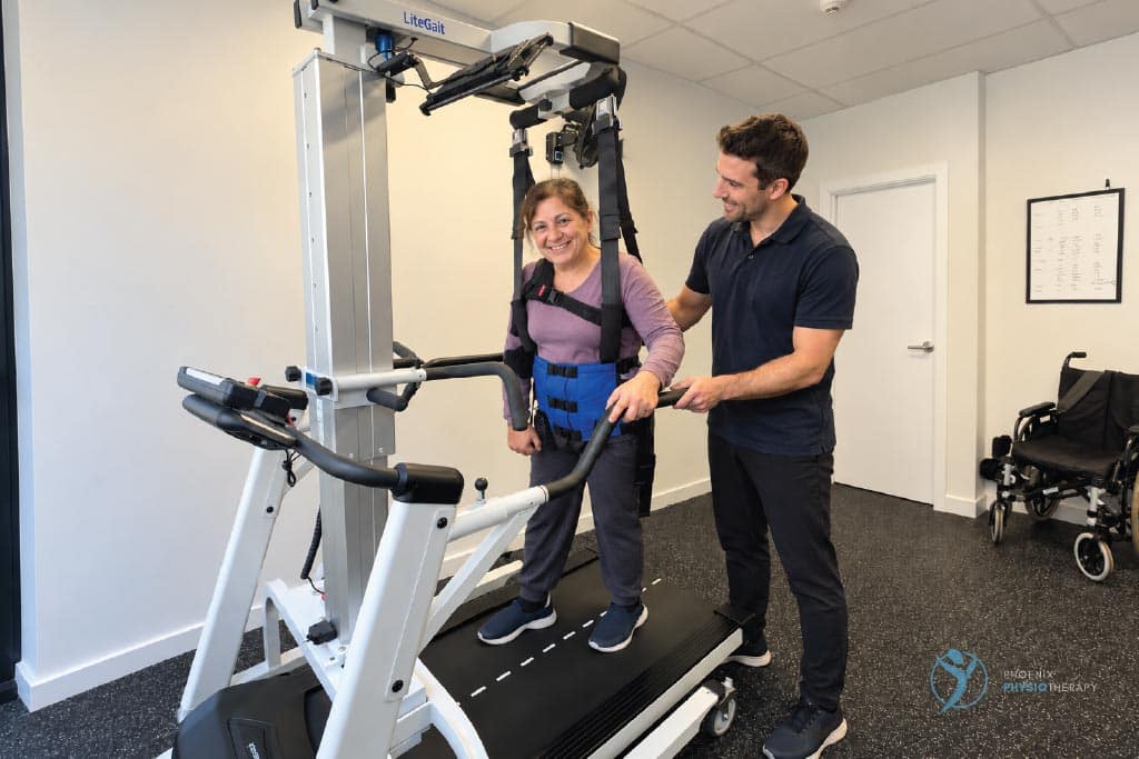 physiotherapist and patient using the litegait